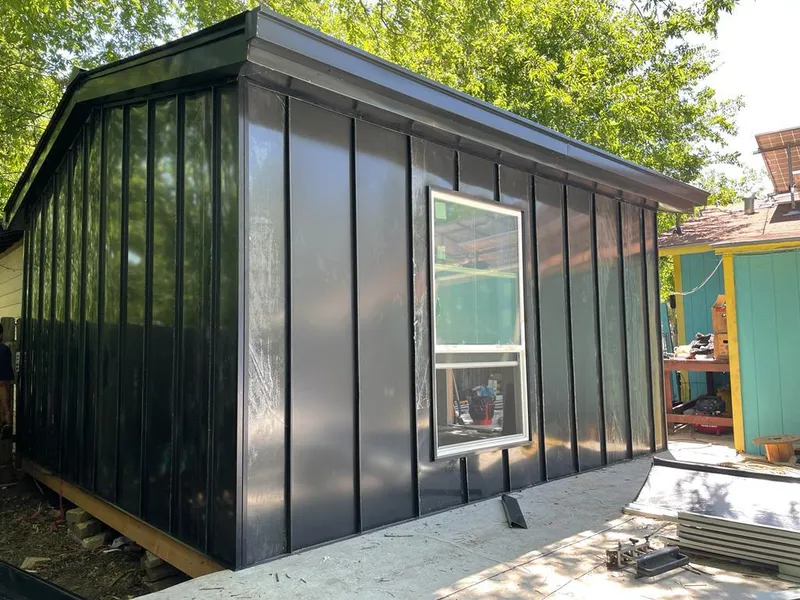 Black standing seam metal wall panels for Roof Inspection in Crestview